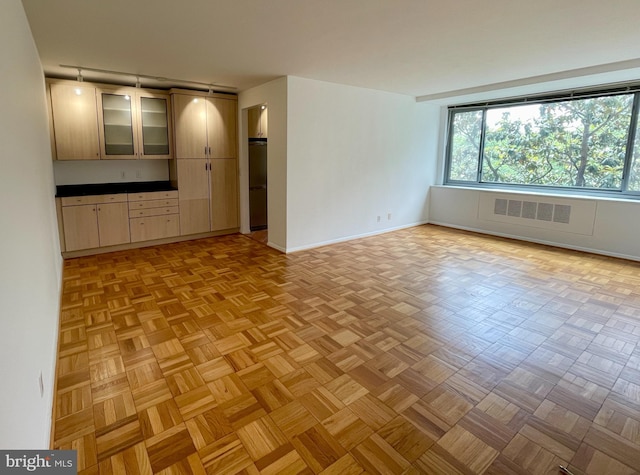 4200 Cathedral Ave NW Unit 918, Washington, DC 20016 - empty room featuring baseboards and track lighting