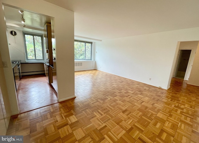 4200 Cathedral Ave NW Unit 918, Washington, DC 20016 - empty room with a baseboard radiator and baseboards