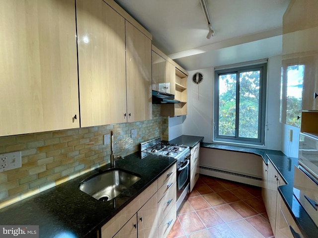 4200 Cathedral Ave NW Unit 918, Washington, DC 20016 - kitchen featuring a sink, stainless steel gas range oven, baseboard heating, exhaust hood, and decorative backsplash