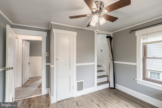 23 Ridge Ave, Hanover, PA 17331 - unfurnished bedroom featuring wood finished floors, ceiling fan, crown molding, and baseboards