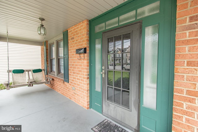 23 Ridge Ave, Hanover, PA 17331 - doorway to property with brick siding and a porch
