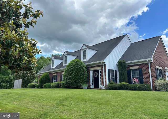 7007 Silent Spring Ln, Fredericksburg, VA 22407 - cape cod home with brick siding and a front lawn