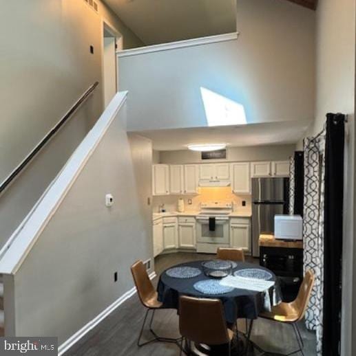 303 Green Meadow Ln, Horsham, PA 19044 - dining room featuring dark wood-style floors and a high ceiling