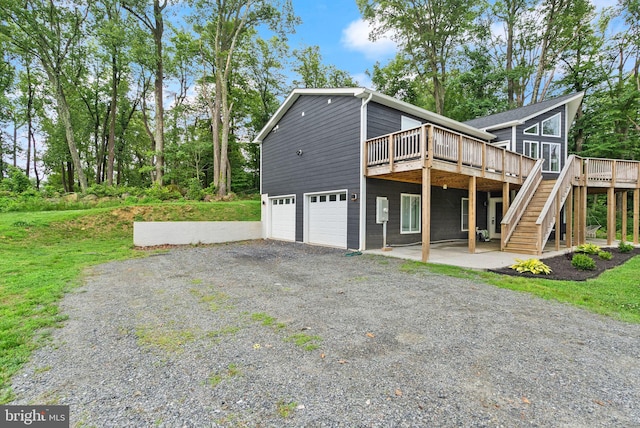 2554 High Top Rd, Linden, VA 22642 - view of property exterior featuring a wooden deck, an attached garage, gravel driveway, and stairway