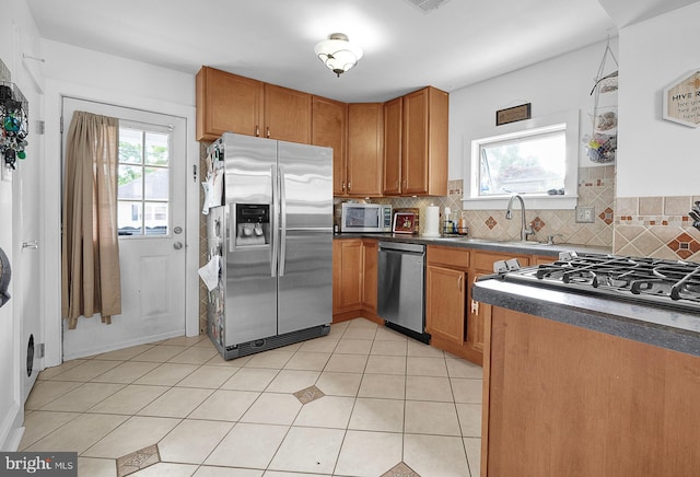 320 Pearl Ave, Horsham, PA 19044 - kitchen featuring stainless steel appliances, a sink, plenty of natural light, and decorative backsplash