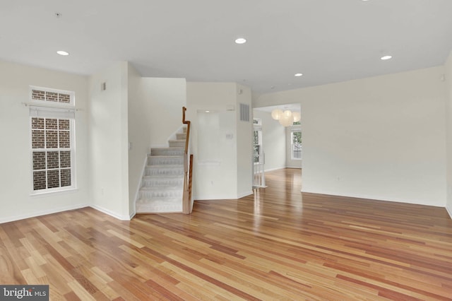 1539 Oakley Ln, Hanover, MD 21076 - unfurnished room with light wood-type flooring, a chandelier, stairway, and recessed lighting