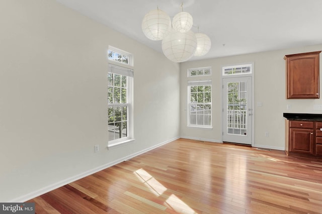 1539 Oakley Ln, Hanover, MD 21076 - unfurnished dining area with light wood finished floors and baseboards