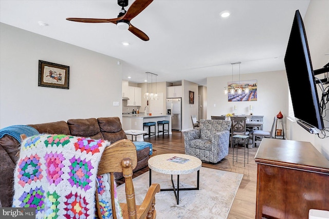 27 Quiet Creek Dr, Gettysburg, PA 17325 - living room with a chandelier, ceiling fan, light wood finished floors, and recessed lighting
