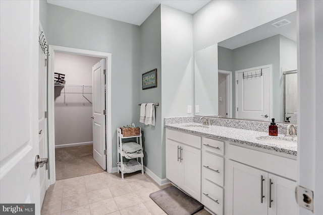 27 Quiet Creek Dr, Gettysburg, PA 17325 - bathroom with double vanity, a spacious closet, and a stall shower