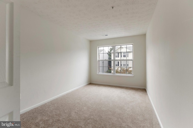 Goose Landing Cir, Columbia, MD 21044 - carpeted spare room with a textured ceiling and baseboards
