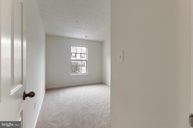 Goose Landing Cir, Columbia, MD 21044 - carpeted empty room featuring a textured ceiling and baseboards