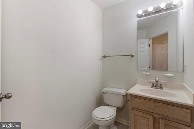 Goose Landing Cir, Columbia, MD 21044 - half bathroom featuring toilet, vanity, and baseboards
