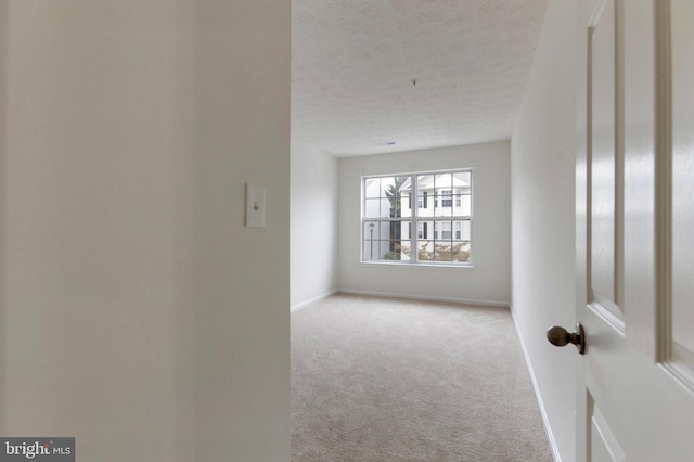 Goose Landing Cir, Columbia, MD 21044 - carpeted empty room featuring a textured ceiling and baseboards