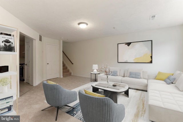 Goose Landing Cir, Columbia, MD 21044 - living area featuring stairs, carpet floors, and baseboards