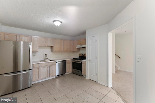 Goose Landing Cir, Columbia, MD 21044 - kitchen featuring appliances with stainless steel finishes, light brown cabinetry, a sink, and a textured ceiling