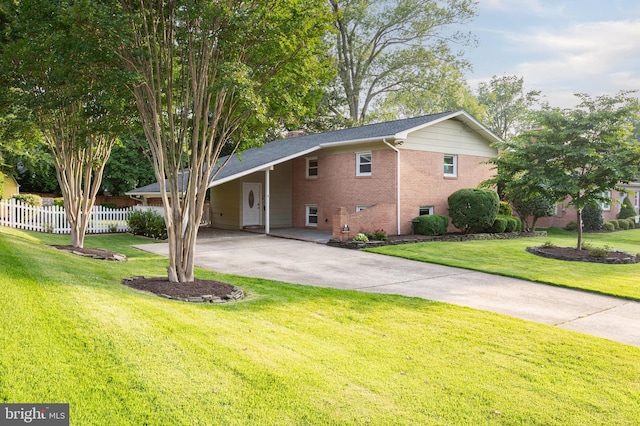 2413 Childs Ln, Alexandria, VA 22308 - view of front of house featuring concrete driveway, brick siding, and a carport