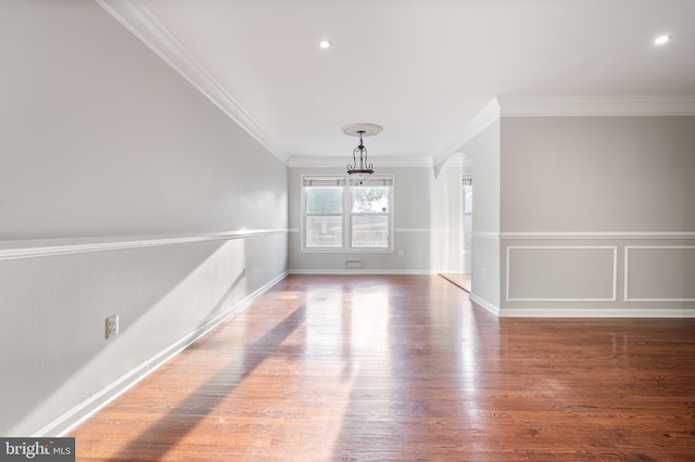 2413 Childs Ln, Alexandria, VA 22308 - empty room with a chandelier, ornamental molding, wood finished floors, arched walkways, and recessed lighting