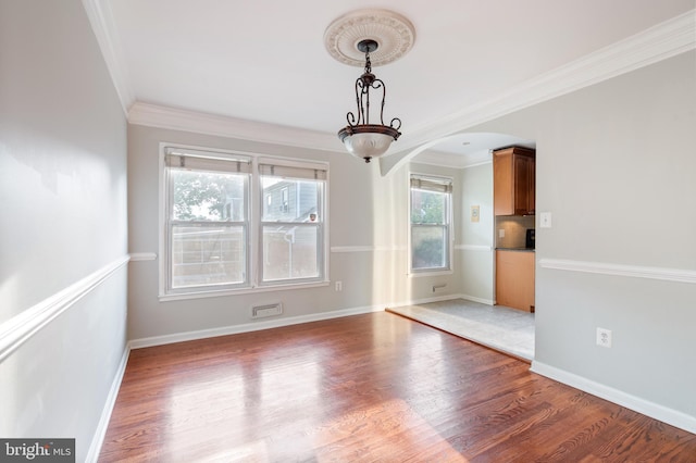 2413 Childs Ln, Alexandria, VA 22308 - spare room featuring arched walkways, light wood-type flooring, and crown molding