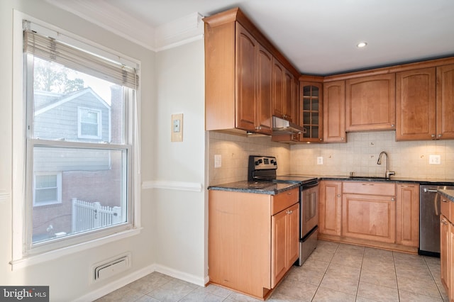 2413 Childs Ln, Alexandria, VA 22308 - kitchen featuring stainless steel appliances, under cabinet range hood, tasteful backsplash, glass insert cabinets, and light tile patterned floors