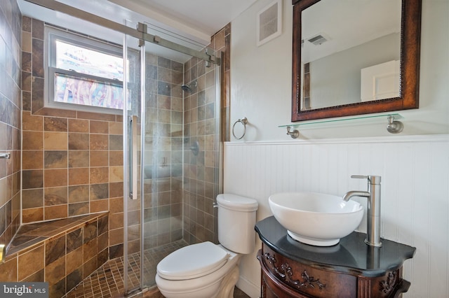 2413 Childs Ln, Alexandria, VA 22308 - bathroom featuring a wainscoted wall, a stall shower, and vanity