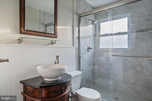 2413 Childs Ln, Alexandria, VA 22308 - bathroom featuring a stall shower, wainscoting, and vanity
