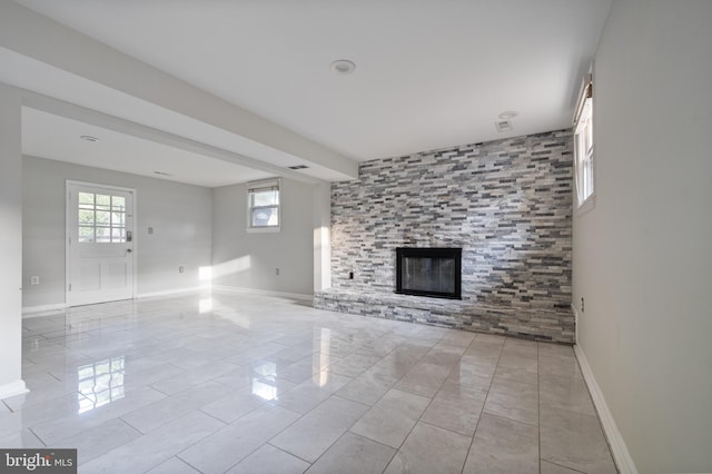 2413 Childs Ln, Alexandria, VA 22308 - unfurnished living room with baseboards and a tile fireplace