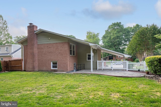 2413 Childs Ln, Alexandria, VA 22308 - back of property featuring a patio, a chimney, and brick siding