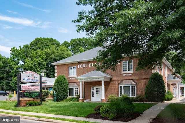 2413 Childs Ln, Alexandria, VA 22308 - view of front of home with brick siding and a front yard