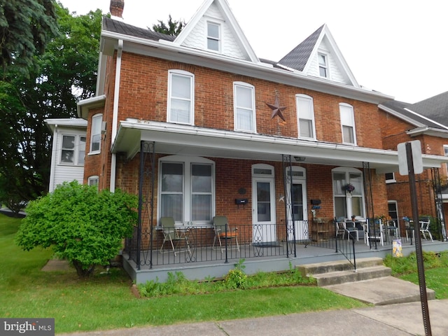 46-48 W Third St, Waynesboro, PA 17268 - multi unit property featuring a porch, brick siding, and a chimney