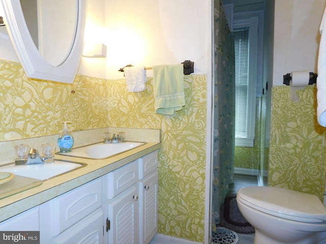 46-48 W Third St, Waynesboro, PA 17268 - bathroom featuring wallpapered walls and double vanity