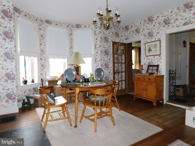 46-48 W Third St, Waynesboro, PA 17268 - dining room with wallpapered walls, dark wood-style floors, and a chandelier