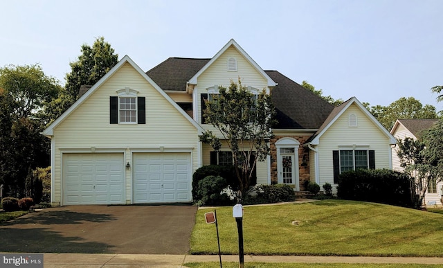 207 Rod Cir, Middletown, MD 21769 - traditional home featuring driveway, an attached garage, a front lawn, and roof with shingles