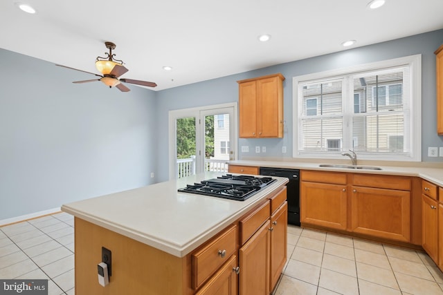 10728 Horde St, Silver Spring, MD 20902 - kitchen with black dishwasher, a sink, gas cooktop, light tile patterned floors, and recessed lighting