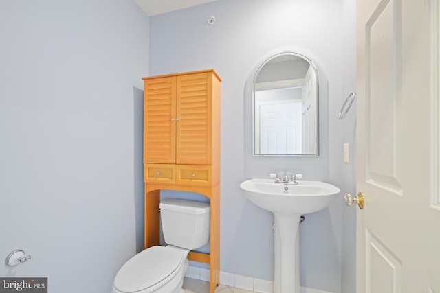 10728 Horde St, Silver Spring, MD 20902 - half bathroom with toilet, tile patterned floors, and baseboards