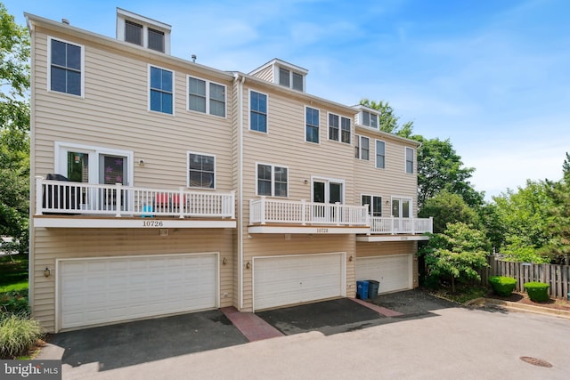 10728 Horde St, Silver Spring, MD 20902 - rear view of house with a garage and driveway