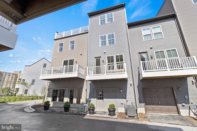 6061 Beake St, Hyattsville, MD 20782 - rear view of property with cooling unit and a garage
