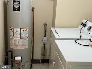 205 Rachel Ct, Franklin Park, NJ 08823 - washroom with gas water heater, separate washer and dryer, and tile patterned floors