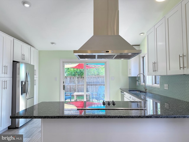 231 E Juniper Ave, Sterling, VA 20164 - kitchen featuring island exhaust hood, stainless steel fridge, dark stone counters, white cabinetry, and recessed lighting