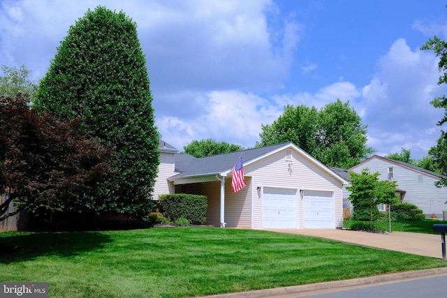 231 E Juniper Ave, Sterling, VA 20164 - view of front of property featuring a garage, a front lawn, and concrete driveway