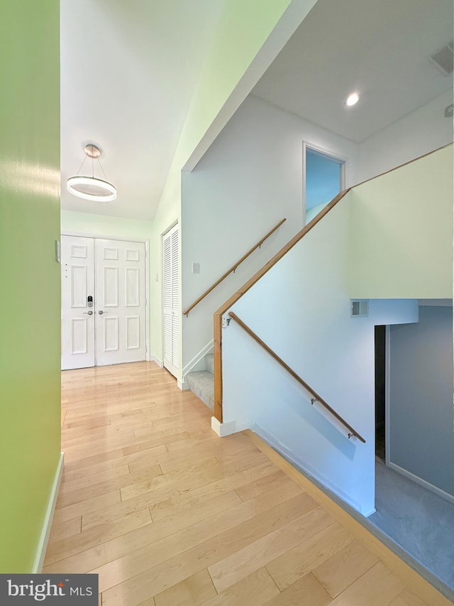 231 E Juniper Ave, Sterling, VA 20164 - hallway featuring wood finished floors, stairway, and recessed lighting