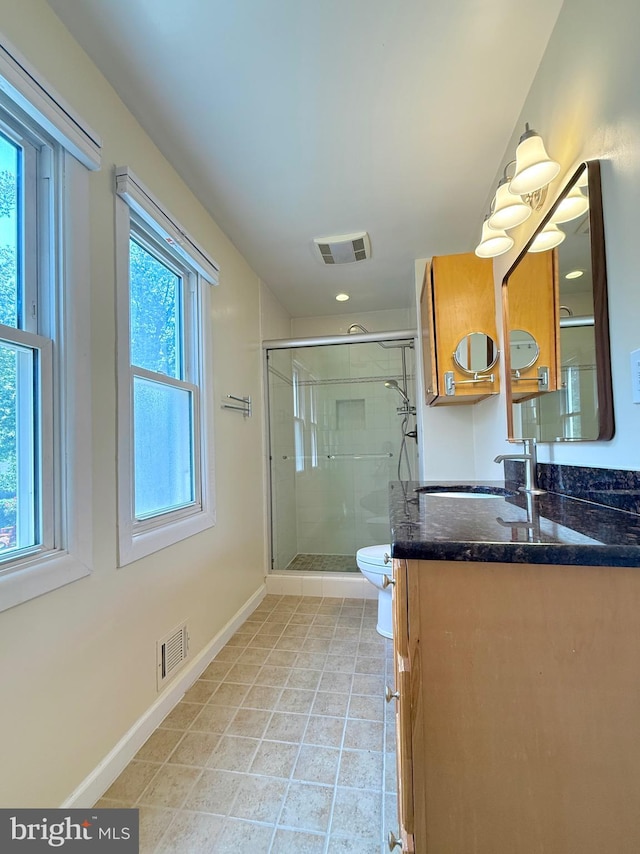 231 E Juniper Ave, Sterling, VA 20164 - bathroom featuring vanity, a shower stall, and tile patterned floors