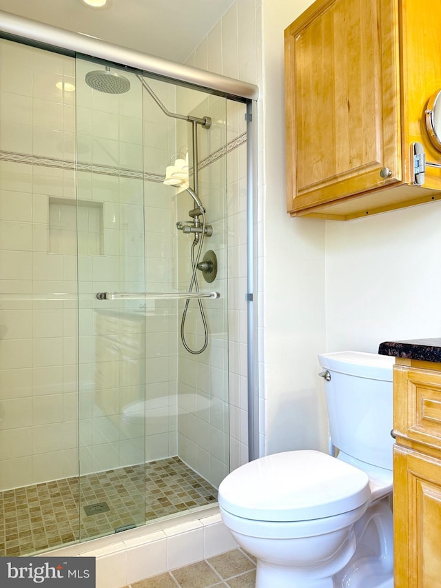 231 E Juniper Ave, Sterling, VA 20164 - bathroom with a shower stall and tile patterned floors