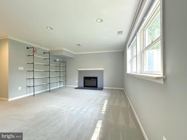 231 E Juniper Ave, Sterling, VA 20164 - unfurnished living room with carpet floors, ornamental molding, a brick fireplace, and recessed lighting