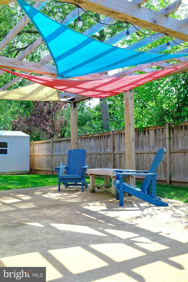 231 E Juniper Ave, Sterling, VA 20164 - view of patio / terrace featuring a storage unit and a pergola