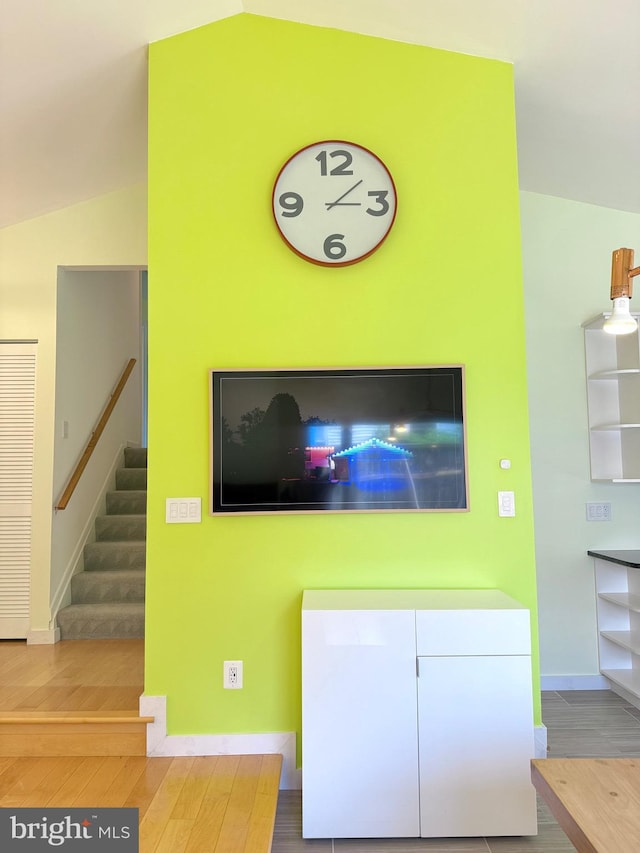 231 E Juniper Ave, Sterling, VA 20164 - living area featuring vaulted ceiling, wood finished floors, and stairs