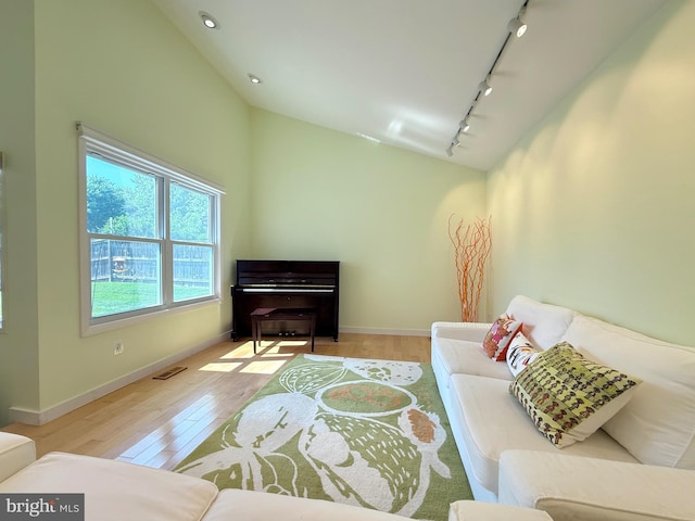 231 E Juniper Ave, Sterling, VA 20164 - living room with rail lighting, wood-type flooring, lofted ceiling, and recessed lighting