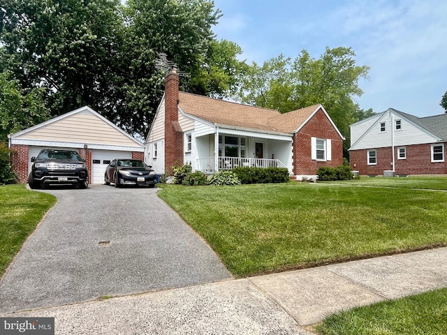 9108 Deborah Ave, Baltimore, MD 21236 - view of front of house with covered porch, a detached garage, a front lawn, and brick siding