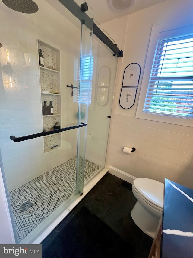 9108 Deborah Ave, Baltimore, MD 21236 - bathroom featuring a shower stall, tile patterned floors, toilet, and baseboards