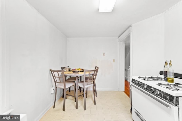 73 Fairfield Ave, Lawrence, NJ 08648 - kitchen with white gas range and baseboards