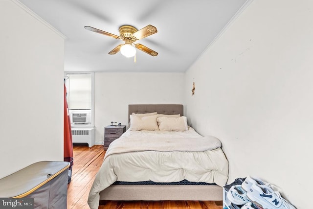 73 Fairfield Ave, Lawrence, NJ 08648 - bedroom with radiator, ornamental molding, wood finished floors, a ceiling fan, and cooling unit